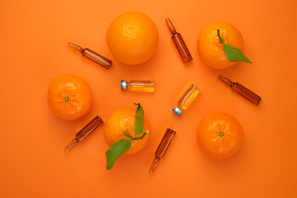 Vitamin C concept. Tangerines citrus fruits, vitamin C in glass